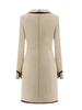 luxury wool mini dress with black trim on a white background