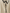Close-up of a beige wool dress with black trim and pearl buttons.