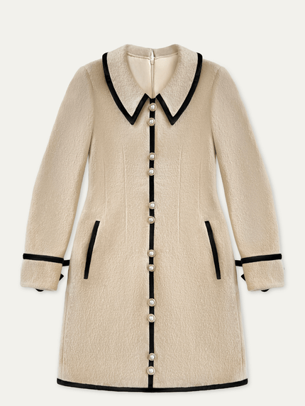 Beige wool mini dress with black trim and gold and pearl buttons on a white background