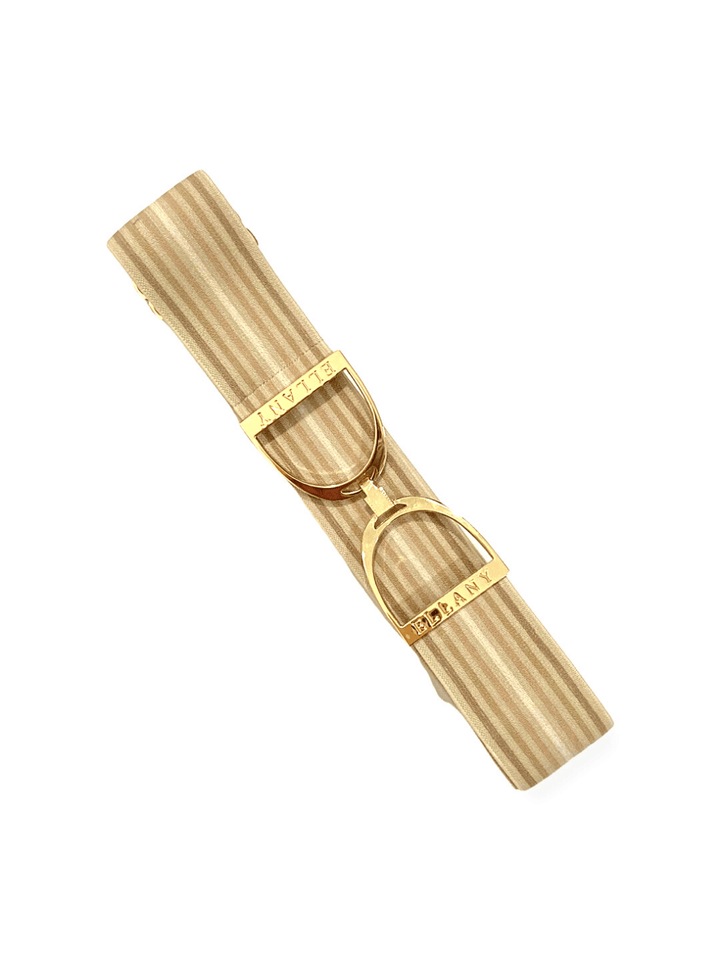 an ivory and gold elastic belt with gold buckle
